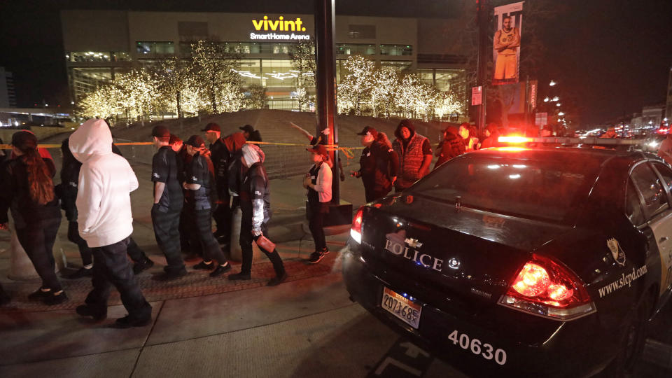 People leave Vivint Smart Home Arena after the Utah Jazz's home arena was evacuated because of a suspicious package following the team's NBA basketball game against the Golden State Warriors on Friday, Nov. 22, 2019, in Salt Lake City. Most fans had already left the building when players, coaches and reporters were instructed to leave the arena following Utah's 113-109 victory. (AP Photo/Rick Bowmer)