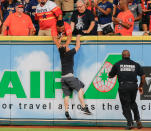 A security guard pushes a fan back onto the warning track after he ran onto the field in the first inning during the game between the Seattle Mariners and the Houston Astros at Minute Maid Park on September 15, 2017 in Houston, Texas. (Photo by Bob Levey/Getty Images)