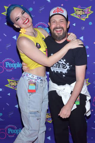 <p>Stephen Lovekin/ Shutterstock</p> Jason Marsden and Christy Marsden pose at 90s Con