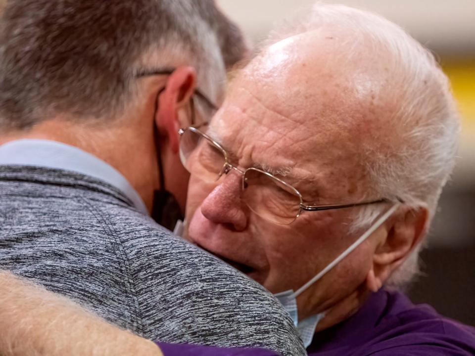 ROWVA/Williamsfield head coach Bob Anderson, right, is congratulated by Stark County coach Dustin Browning following the Cougars' 53-35 win over the Rebels on Friday, Jan. 21, 2022 at ROWVA High School. The win was the 700th in Anderson's career.