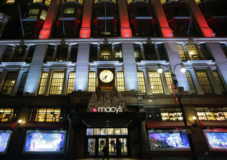 FILE - In this Tuesday, Dec. 17, 2013, file photo, Macy's department store in Herald Square is illuminated with holiday lighting, in New York. Macy's said Wednesday, Jan. 8, 2014, it is laying off 2,500 workers as it restructures business. (AP Photo/Mark Lennihan, File)