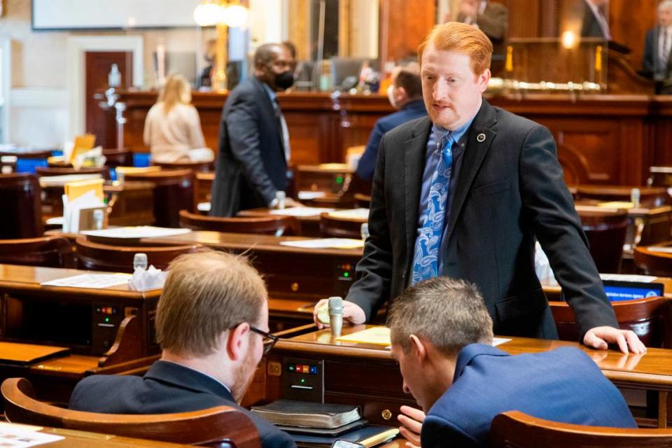 State Rep. Josiah Magnuson R-Spartanburg speaks with colleagues at the South Carolina State House on January 11, 2022.