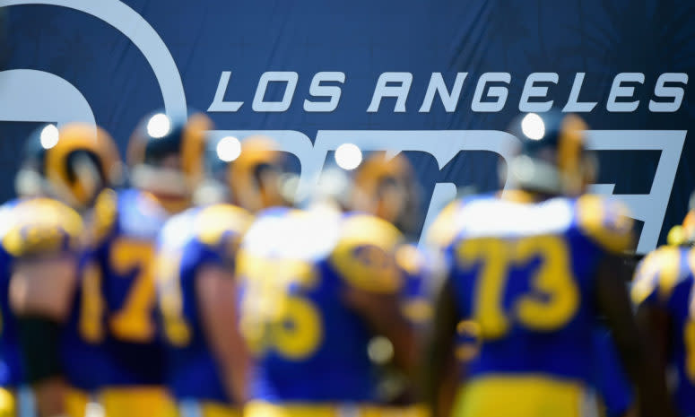 A blurry pictures of players on the Los Angeles Rams.