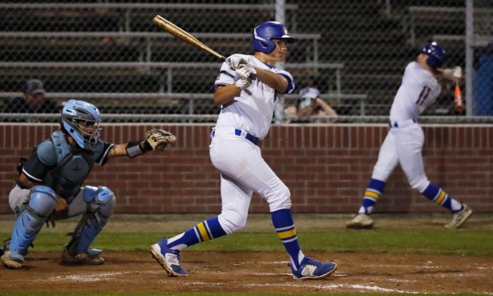 Exeter's Miles Munger lines a single against Central Valley Christian during their non-league baseball game in Exeter, Calif., Thursday, April 18, 2024.