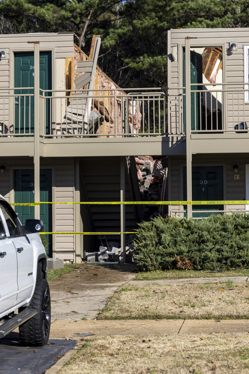 Sagewood Apartments is damaged from Tuesday night's severe weather, with the roof of one building torn off and much the second level destroyed, Wednesday, Nov. 30, 2022, in Eutaw, Ala. (AP Photo/Vasha Hunt)