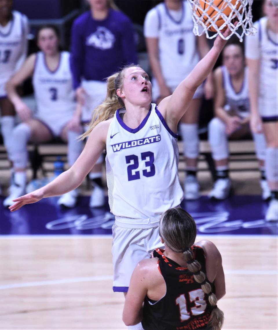 ACU's Claire Graham drive to the basket for a score as Sam Houston's Kaylee Jefferson defends. Graham was called for a charge on the play, wiping out a basket that would have pulled ACU within four (65-61) with 4:16 left in the game.