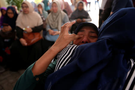 A woman, who is family of passengers on the crashed Lion Air flight JT610, cries at Bhayangkara R. Said Sukanto hospital in Jakarta, Indonesia, October 30, 2018. REUTERS/Willy Kurniawan