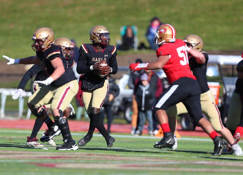 Iona Prep quarterback Ajani Sheppard (3) rolls out of the pocket during their 38-22 win over St. Francis.