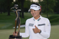 Jin Young Ko, of South Korea, poses for a photo with the trophy after winning the LPGA Cognizant Founders Cup golf tournament in a playoff, Sunday, May 14, 2023, in Clifton, N.J. (AP Photo/Seth Wenig)