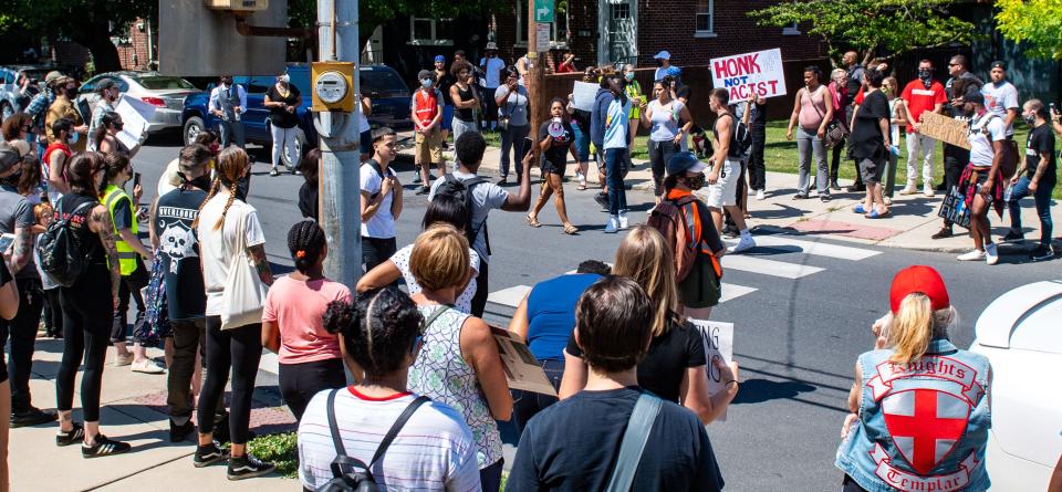 Supporters of the Black Lives Matter movement hold a rally near the Lancaster Recreation Center, where former Vice President Joe Biden is visiting Pennsylvania families, June 25, 2020.