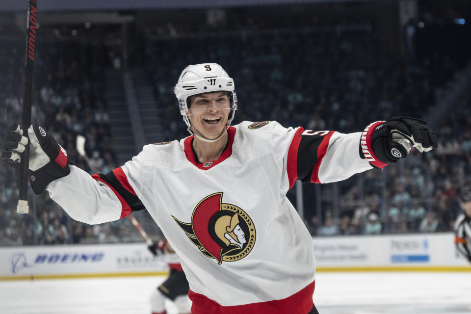 Ottawa Senators defenseman Nick Holden celebrates a goal against the Seattle Kraken during the first period of an NHL hockey game Thursday, March 9, 2023, in Seattle. (AP Photo/Stephen Brashear)