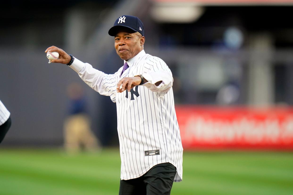New York City Mayor Eric Adams throws out a ceremonial first pitch before a baseball game between the New York Yankees and the Toronto Blue Jays in the Bronx, New York on Tuesday, May 10, 2022.
