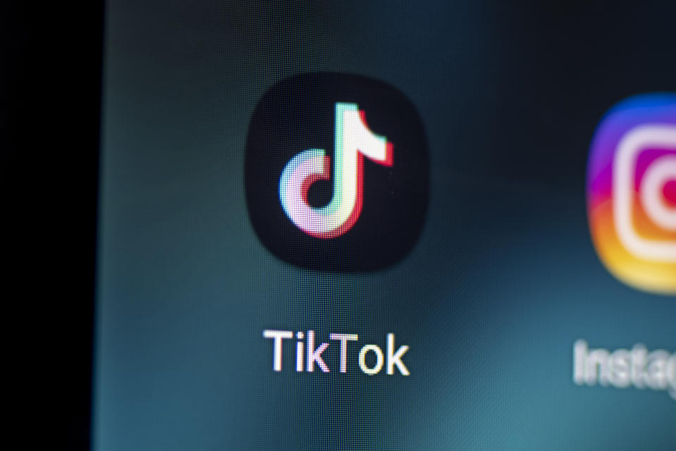 PRODUCTION - 28 April 2021, Berlin: The logo of the app TikTok is seen on the screen of a smartphone. US President Joe Biden has lifted the bans on the apps Tiktok and WeChat ordered by his predecessor Donald Trump. (to dpa 