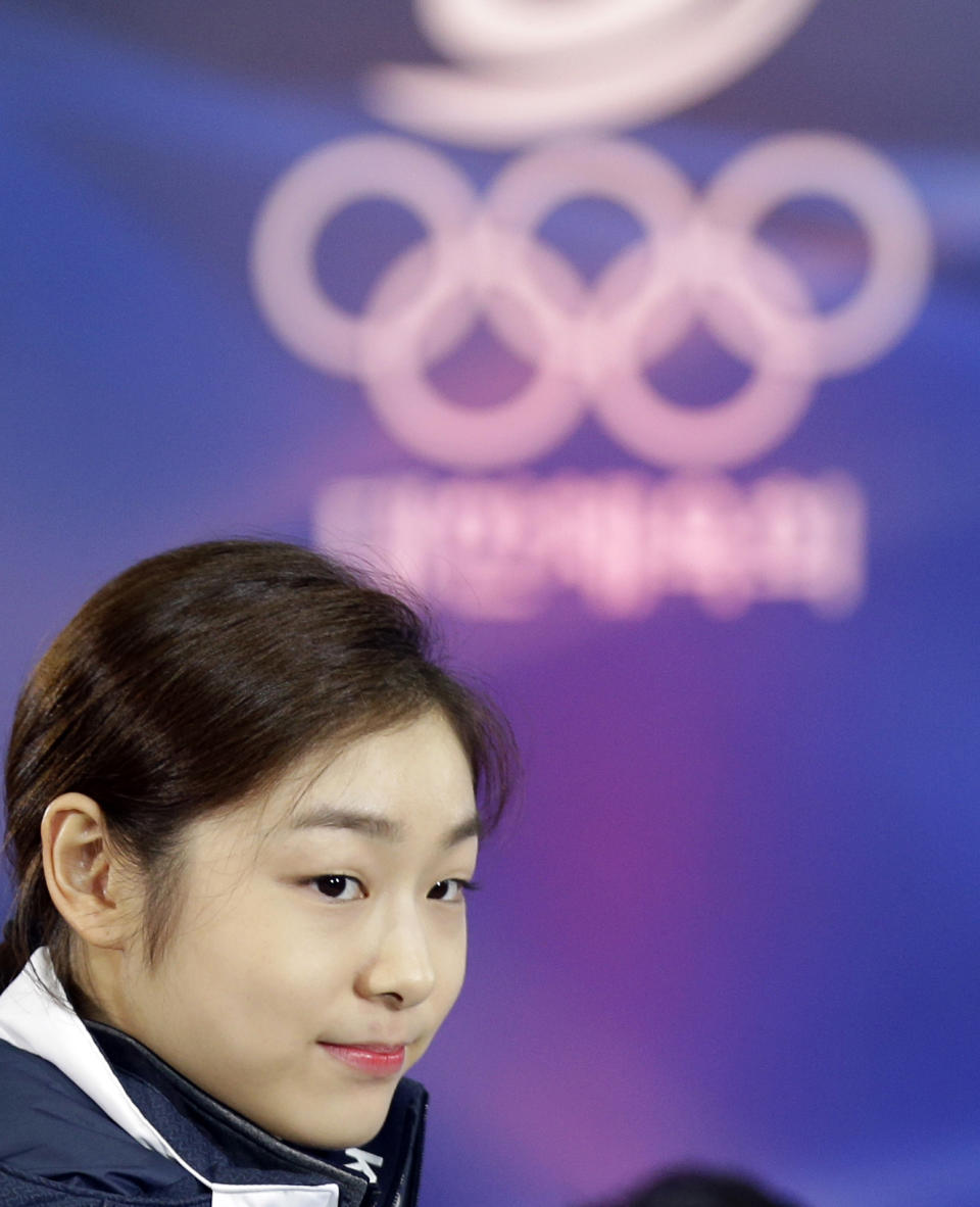 South Korean Kim Yuna, Vancouver gold medalist for the women's figure skating, attends the inaugural ceremony of the South Korean team for the Sochi Winter Olympics in Seoul, South Korea, Thursday, Jan. 23, 2014. South Korea will send 64 athletes to Sochi which will be held from Feb. 7-23. (AP Photo/Lee Jin-man)