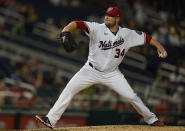 Washington Nationals starting pitcher Jon Lester (34) delivers during a baseball game against the Pittsburgh Pirates, Monday, June 14, 2021, in Washington. (AP Photo/Carolyn Kaster)