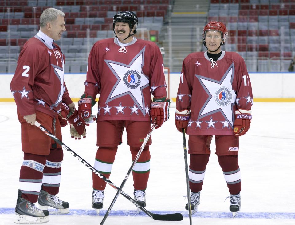 Russian President Putin, his Belarussian counterpart Lukashenko and retired Russian ice hockey player Fetisov take part in a friendly ice hockey match in the Bolshoi Ice Palace near Sochi