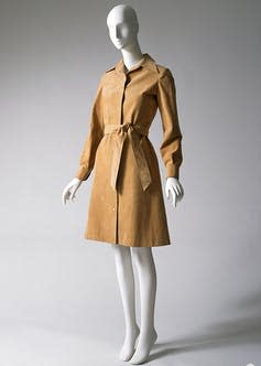 A mannequin dressed in a tan Halston shirtdress.