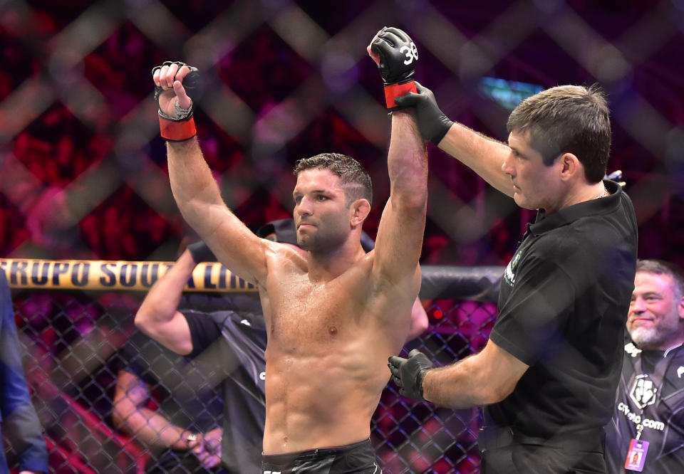 Jan 21, 2023; Rio de Janeiro, Brazil; Thiago Moises (red gloves) reacts after the fight against Melquizael Costa (blue gloves) during UFC 283 at Jeunesse Arena. Mandatory Credit: Jason da Silva-USA TODAY Sports