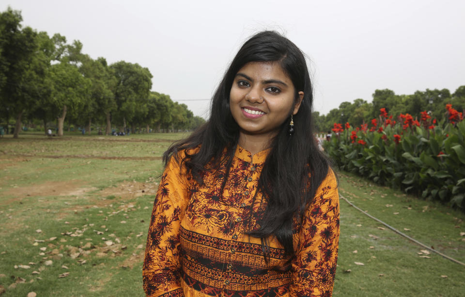 In this Tuesday, April 16, 2019, photo, a banking and financial services student Kavita Srivastava, 18, stands for a photograph in New Delhi, India. With nearly half the electorate under 35 and more than 15 million first time voters, India's young can swing the national vote in the world's largest democracy in any direction. “The biggest issue in Delhi is girls’ safety, which is still not 100%. So the main issue is that ... girls should feel safe leaving their homes and going out at whatever time of the night. I don’t think Rahul Gandhi is the best option. I too am in support of Narendra Modi. I think he has the potential to take India to those heights," Srivastava said. (AP Photo/Manish Swarup)