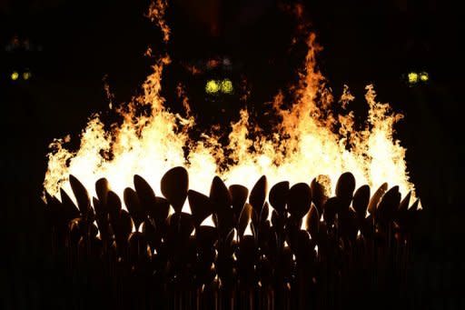 The Olympic flame burns during the opening ceremony of the London 2012 Olympic Games at the Olympic Stadium in London