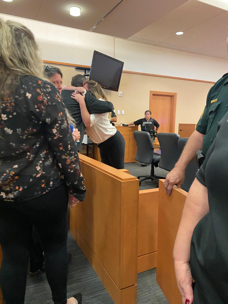 Heather Finley hugs her father in court on Thursday.