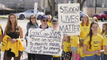 FILE - In this April 10, 2021, file photo, parents and students protest students wearing masks to school during a rally in Farmington, Utah. Dozens of school districts around the country have eliminated requirements for students to wear masks, and many more are likely to ditch mask requirements before the next academic year. (AP Photo/Rick Bowmer, File)