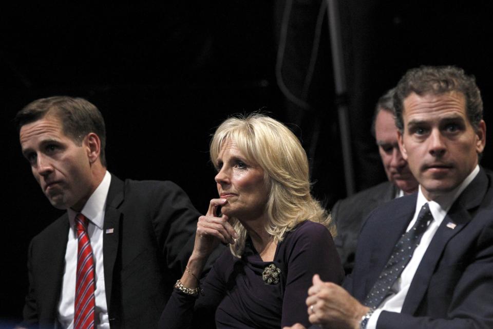 Jill Biden (center) wife of Vice President Joe Biden, sits with her sons Beau Biden (left) and Hunter Biden (right) before the start of the vice presidential debate Thursday at Centre College in Danville, Ky.  Mary Altaffer/AP