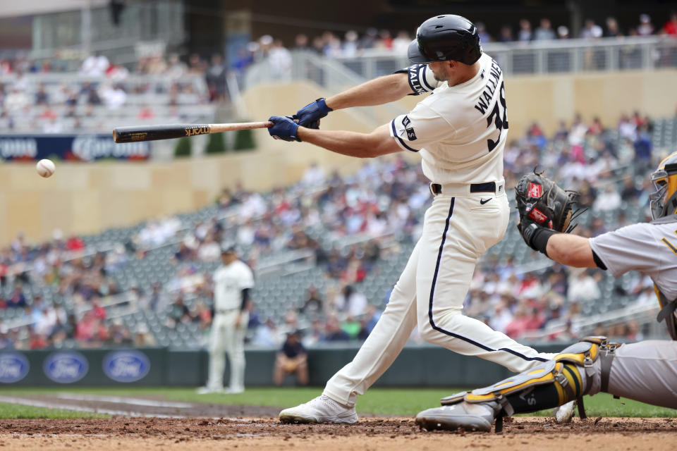 Minnesota Twins' Matt Wallner grounds into a double play during the sixth inning of the team's baseball game against the Oakland Athletics Thursday, Sept. 28, 2023, in Minneapolis. Teammate Willi Castro scored on the play. (AP Photo/Andy Clayton-King)