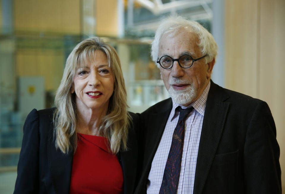 Joe Herbert, right, Emeritus Professor of Neuroscience at the University of Cambridge and Barbara Sahakian, left, professor of Clinical Neurophychology at the same university, pose for the photographer prior to a news conference to announce the results of a new study in central London, Monday, Feb. 17, 2014. A saliva test for teenage boys with mild symptoms of depression could help predict those who will later develop major depression, the new study says. Researchers who measured cortisol levels in teenagers found that boys with high levels of the hormone and mild depression symptoms were 14 times more likely to later suffer from clinical depression than those with low levels. Herbert said: "You don’t have to rely simply on what the patient tells you, but what you can measure inside the patient," comparing the new test to those done for other health problems, like heart disease, which evaluate things like cholesterol and high blood sugar to determine a patient’s risk. (AP Photo/Lefteris Pitarakis)