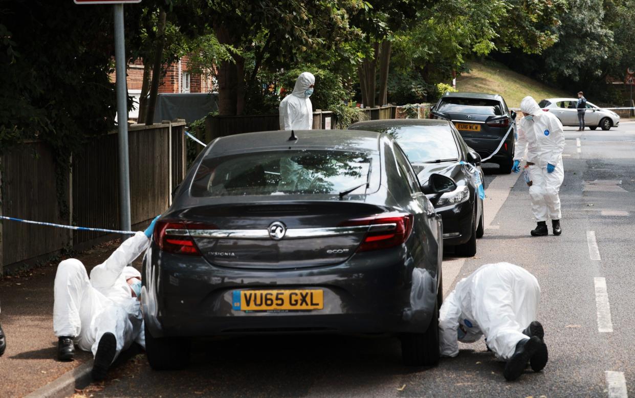 Forensic officers search near the scene at Sally Port after a soldier in uniform was stabbed on Tuesday