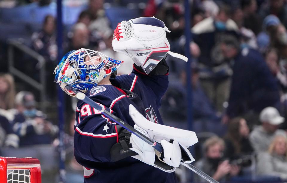 Columbus Blue Jackets goaltender Elvis Merzlikins (90) gives a look up to the rafters during the second period of the NHL hockey game against the New Jersey Devils at Nationwide Arena in Columbus on March 1, 2022. 