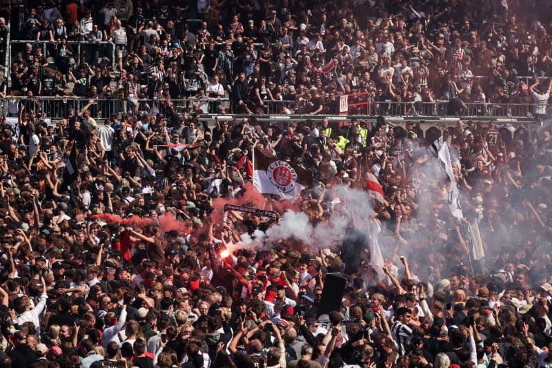 St. Pauli fans celebrate after the German Bundesliga 2 soccer match between FC St. Pauli and VfL Osnabruck at the Millerntor Stadium. Christian Charisius/dpa