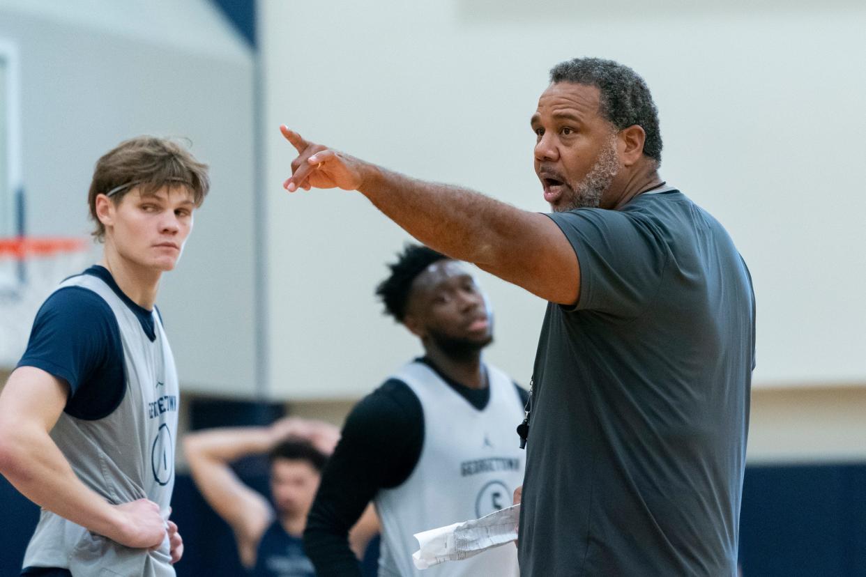 Georgetown NCAA college basketball head coach Ed Cooley, right, motions while instructing players during practice, Thursday, Oct. 19, 2023, in Washington. (AP Photo/Stephanie Scarbrough)