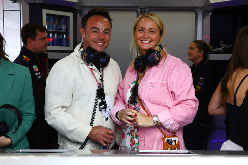 NORTHAMPTON, ENGLAND - JULY 08: Ant McPartlin and Anne-Marie McPartlin pose for a photo in the Red Bull Racing garage prior to final practice ahead of the F1 Grand Prix of Great Britain at Silverstone Circuit on July 08, 2023 in Northampton, England. (Photo by Mark Thompson/Getty Images)