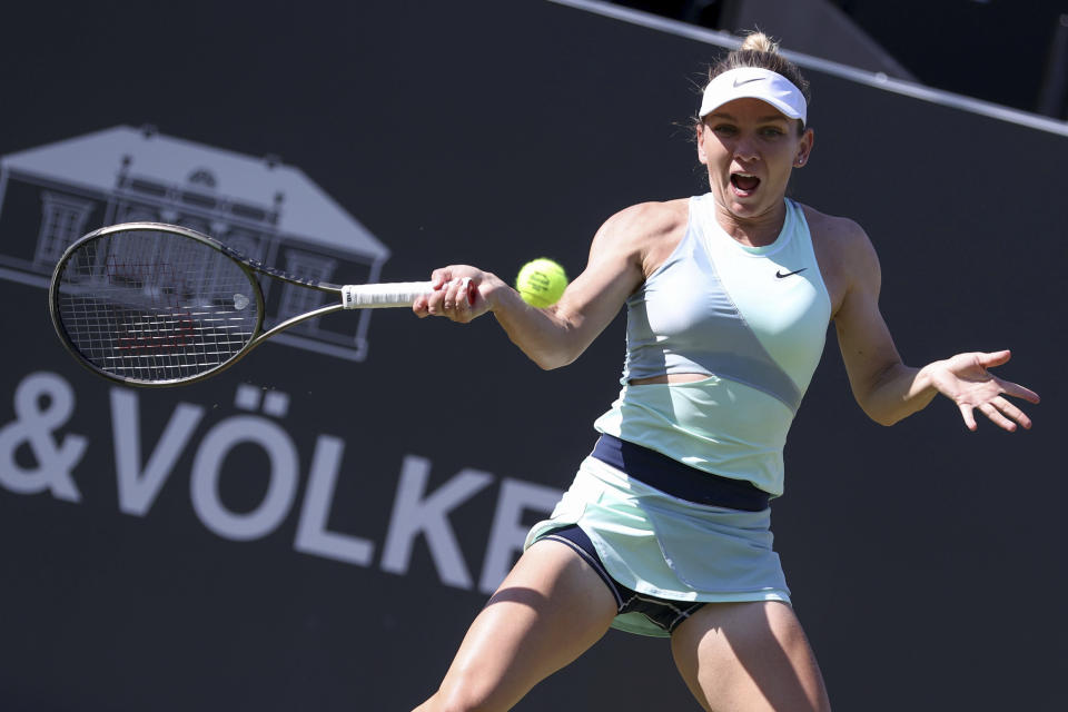 Romania's Simona Halep returns a ball to Czech Republic's Katerina Siniakova during the WTA Tour singles match in Bad Homburg, Germany, Tuesday June 21, 2022. (Joaquim Ferreira/dpa via AP)