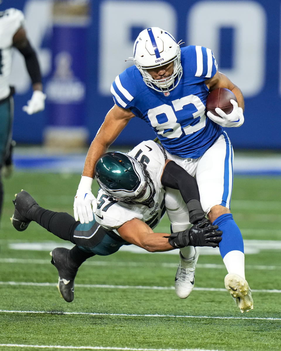 Philadelphia Eagles linebacker T.J. Edwards (57) tackles Indianapolis Colts tight end Kylen Granson (83) in the first half of an NFL football game in Indianapolis, Sunday, Nov. 20, 2022. (AP Photo/AJ Mast)