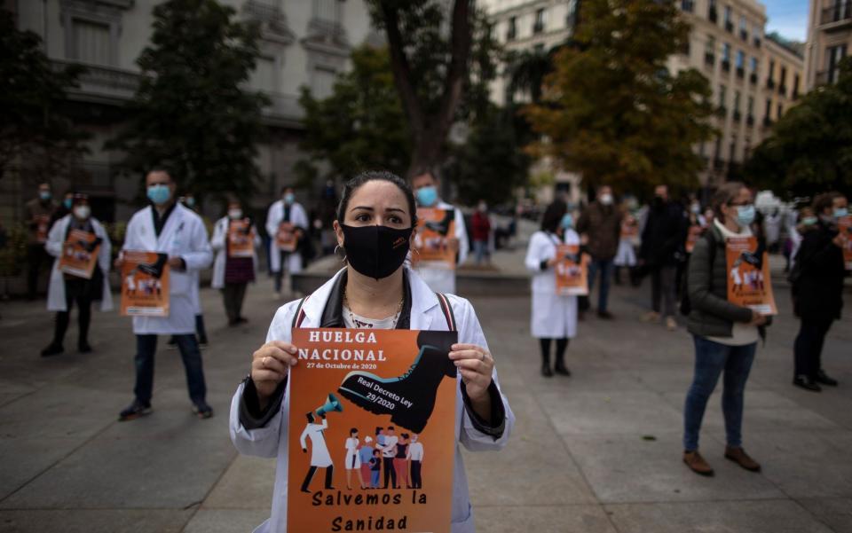 Health services members protest calling for a general strike and demanding more labor protection on their jobs in Madrid, Spain - Manu Fernandez/AP Photo