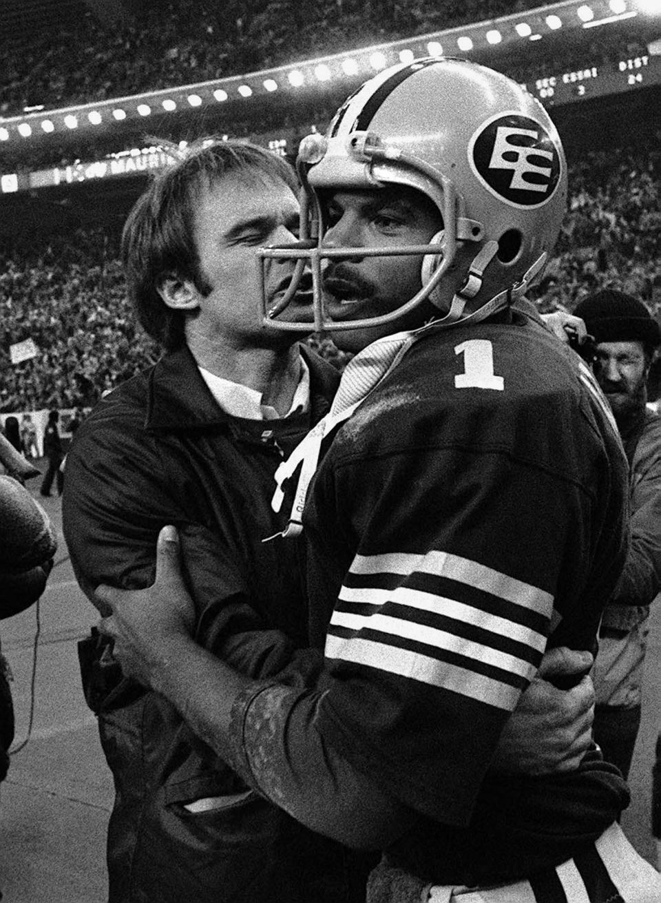 Edmonton Eskimos head coach Hugh Campbell hugs QB Warren Moon after the team defeated the Montreal Alouettes for the second consecutive year to win the Grey Cup in 1979. (The Canadian Press)