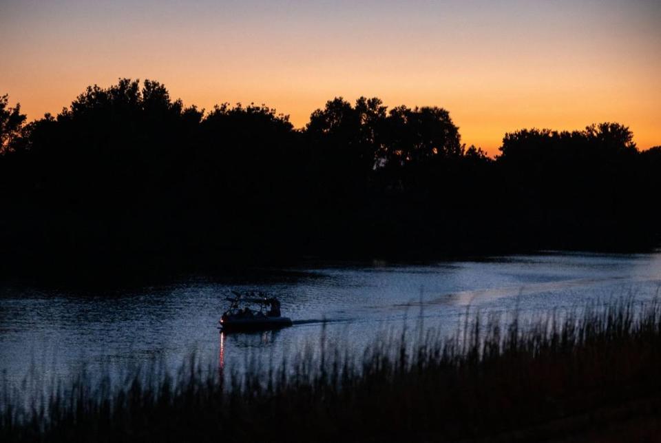 Boaters head south on the Sacramento River, north of Locke, through the Sacramento-San Joaquin Delta region in 2021.