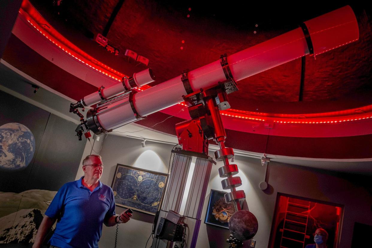 Cox Science Center and Aquarium volunteer Bill Bucklew, unincorporated Palm Beach County, stands with the refractor telescope he designed and helped build at the center in West Palm Beach, Fla., on Wednesday, January 5, 2022. The telescope is the largest refractor telescope in south Florida, Bucklew said.