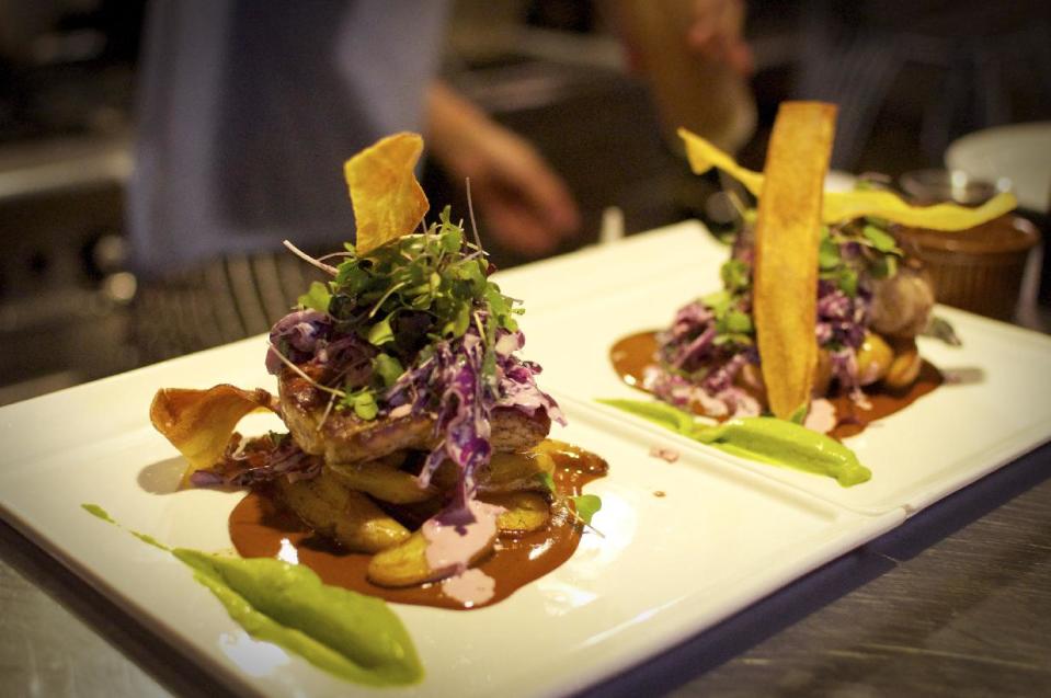 This undated image released by The Admiral restaurant shows a dish called SC Wahoo made of avocado puree, smoked fingerlings with a cilantro slaw and crispy plantains at the restaurant in Asheville, N.C. (AP Photo/The Admiral, Melissa Robinson)