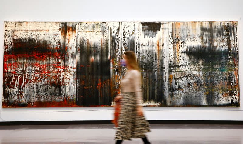 A woman walks past the painting "St. Gallen" by German painter Gerhard Richter at the Kunsthaus Zurich art museum in Zurich