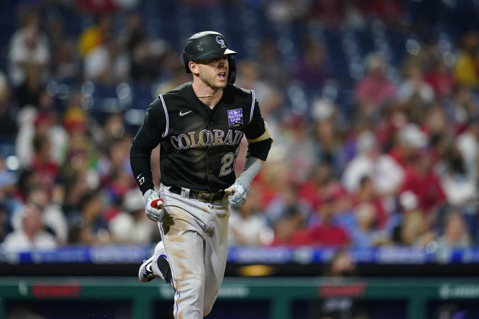 Colorado Rockies' Trevor Story reacts after hitting a home run against Philadelphia Phillies pitcher Zack Wheeler during the sixth inning of a baseball game, Saturday, Sept. 11, 2021, in Philadelphia. (AP Photo/Matt Slocum)