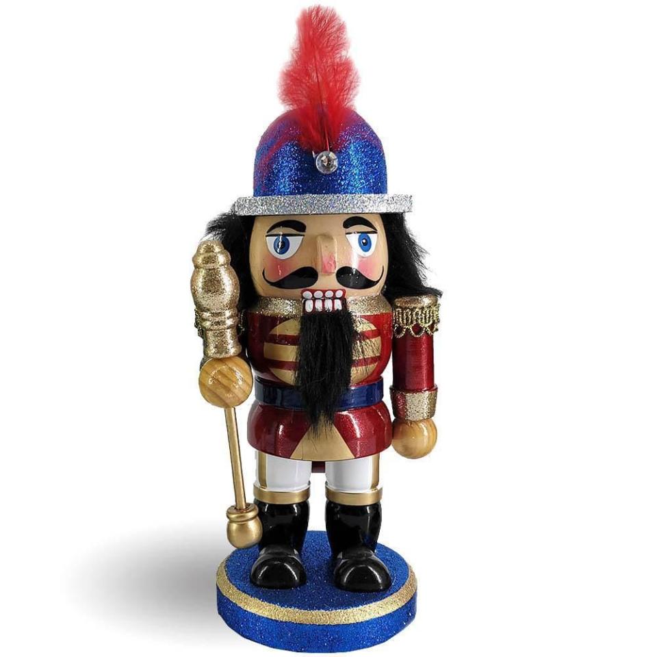 <p>nutcrackerballetgifts.com</p><p><strong>$16.50</strong></p><p><a href="https://nutcrackerballetgifts.com/collections/nutcrackers-under-15/products/chubby-soldier-nutcracker-in-blue-red-and-gold-with-sword-8-inch" rel="nofollow noopener" target="_blank" data-ylk="slk:Shop Now;elm:context_link;itc:0;sec:content-canvas" class="link ">Shop Now</a></p><p>What's Christmas without a nutcracker? This adorable little soldier should fit perfectly in their stocking and it's a great addition to any nutcracker collection. </p>