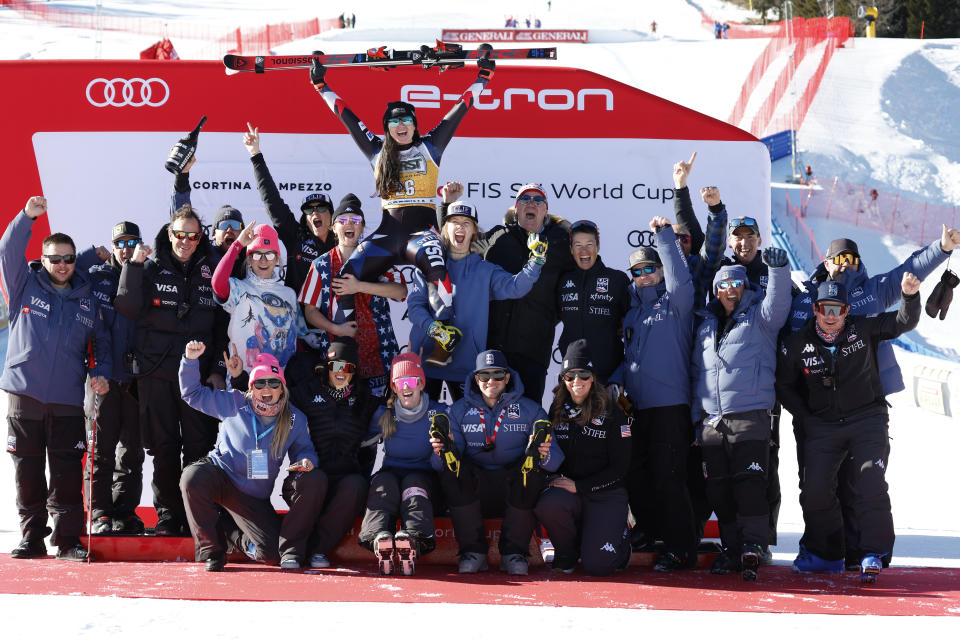 Second placed United States' Jacqueline Wiles celebrates with the team after an alpine ski, women's World Cup downhill race, in Cortina d'Ampezzo, Italy, Saturday, Jan. 27, 2024. (AP Photo/Alessandro Trovati)