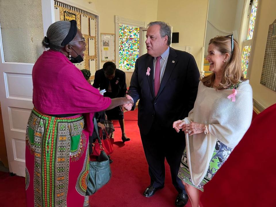 Barbara Washington shakes the hands of former New Jersey governor and GOP presidential candidate Chris Christie and wife Mary Pat Christie after Sunday worship at Tabernacle Baptist Church in Beaufort, South Carolina.