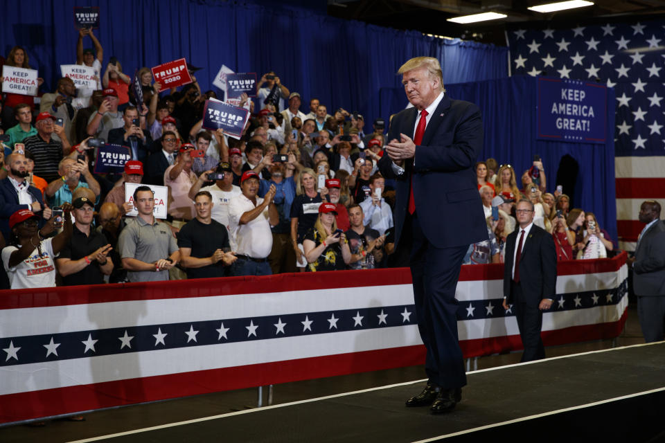 President Donald Trump arrives on stage at the Crown Expo for a campaign rally, Monday, Sept. 9, 2019, in Fayetteville, N.C. (AP Photo/Evan Vucci)