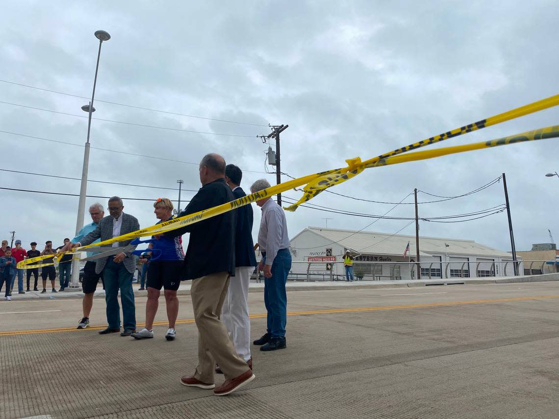 Fort Worth Mayor Betsy Price cuts caution tape that was stretched across the White Settlement Road bridge when it opened in 2021..