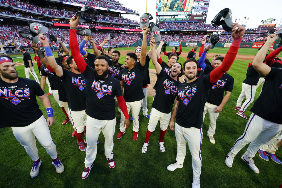 The Philadelphia Phillies pose for a photo after a win over the Atlanta Braves in Game 4 of baseball's National League Division Series, Saturday, Oct. 15, 2022, in Philadelphia. The Philadelphia Phillies won, 8-3.(AP Photo/Matt Rourke)