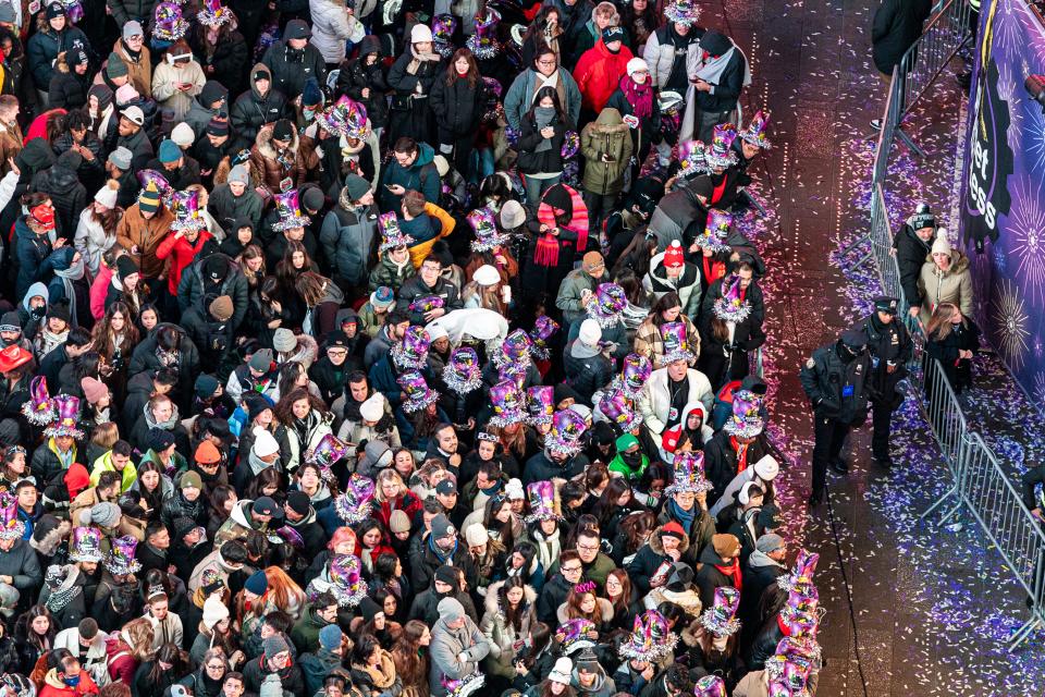 Crowds gather in Times Square for the New Year’s Eve celebration in New York, Sunday, 31 December 2023 (AP)